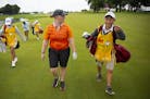 Nikki Jung (left) talked with her caddy, Jacob Roy, about the recently renovated 18th hole during a Pro-Am round on Monday. ALEX KORMANN &#xa5; alex.k