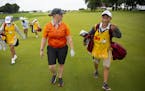 Nikki Jung (left) talked with her caddy, Jacob Roy, about the recently renovated 18th hole during a Pro-Am round on Monday. ALEX KORMANN &#xa5; alex.k