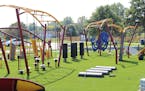 Workers put the finishing touches on the new challenge course at Schaper Park in Golden Valley this week. It is the first of its kind in the state.