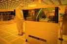 Polar Semiconductor employees work in one of three fabrication areas inside the company's expansive clean room.