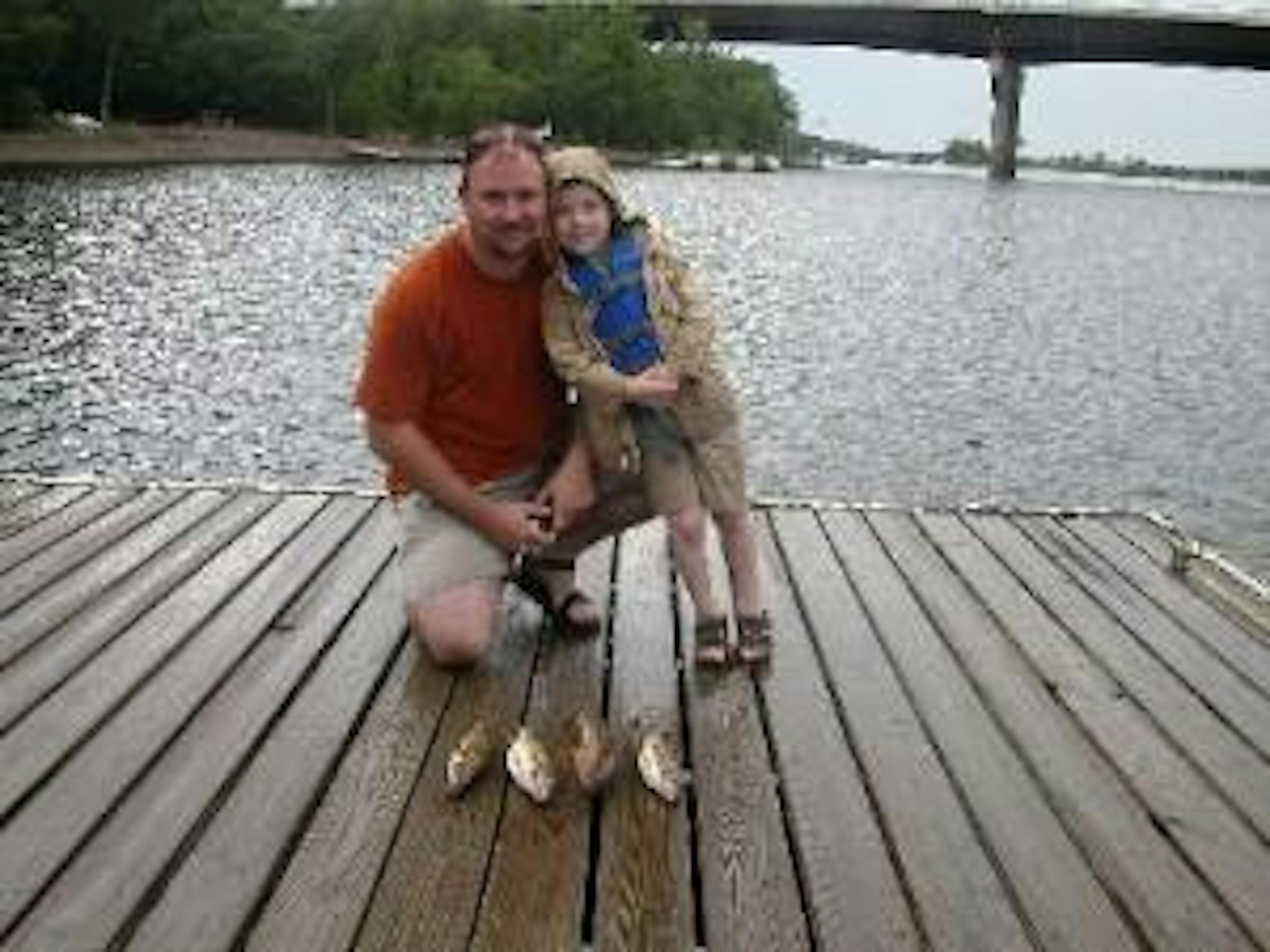 Young Ben with his dad enjoying a day of fishing together.