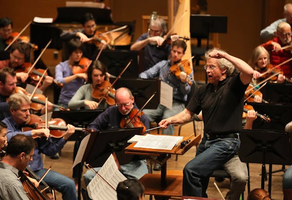 Members of the Minnesota Orchestra, led by Osmo Vanska, practice at Orchestra Hall.