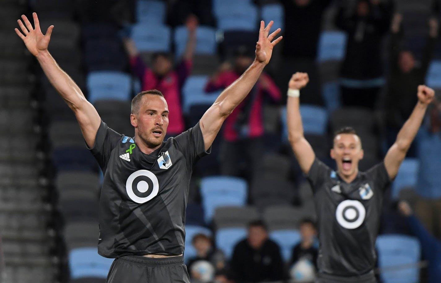 Minnesota United defender Brent Kallman (14) and midfielder Jan Gregus (8) celebrated a game-winning goal by midfielder Robin Lod in a game earlier this season.