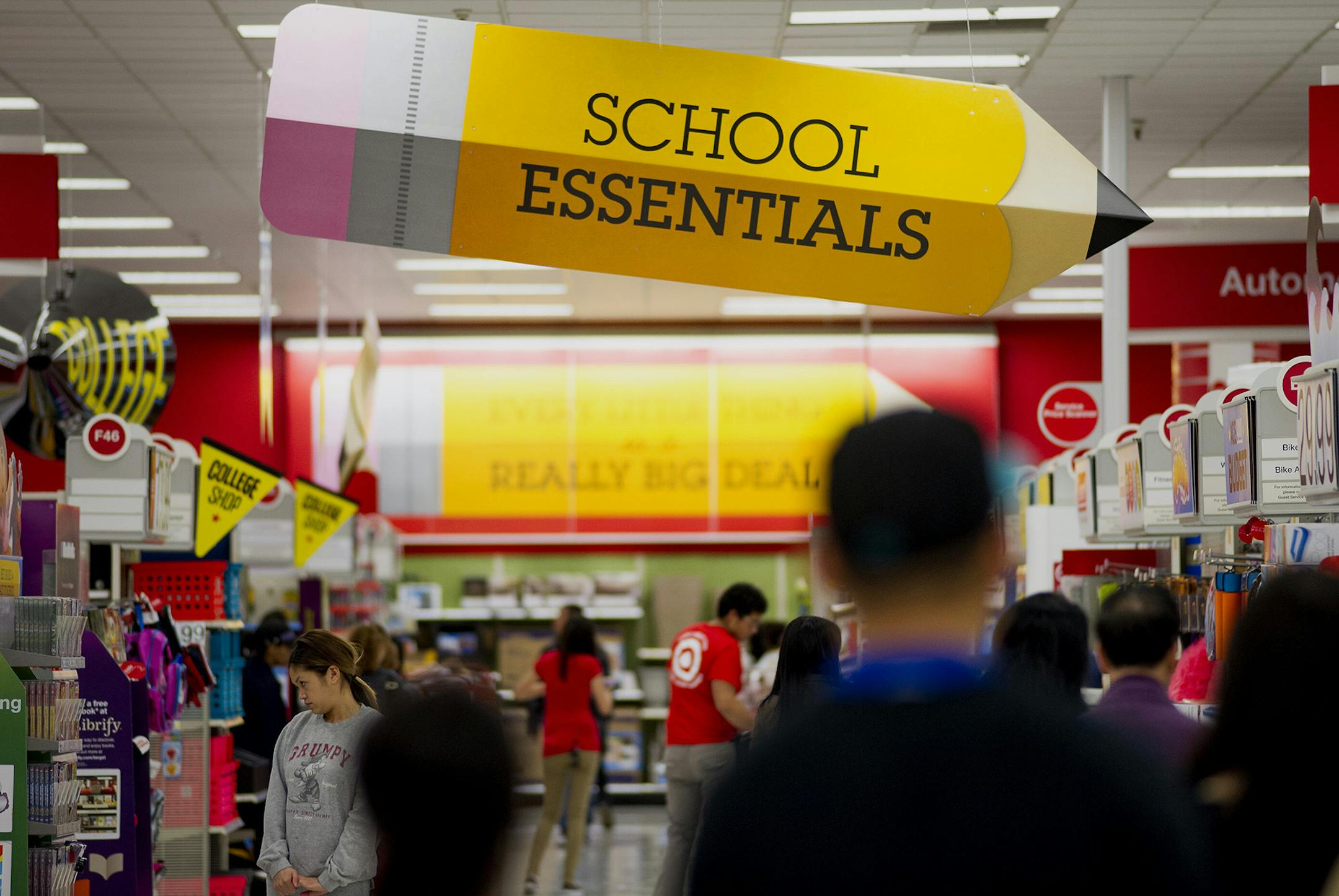 Customers shop for back to school supplies at a Target Corp. store in Colma, California, U.S., on Saturday, Aug. 9, 2014. Retailers are pushing for a longer shopping season and earlier than ever deals on order to get customers to buy more over a longer period of time, says DealNews spokesman Mark LoCastro, which tracks price and discount trends across the web, according to USA Today. Photographer: David Paul Morris/Bloomberg ORG XMIT: 506646325