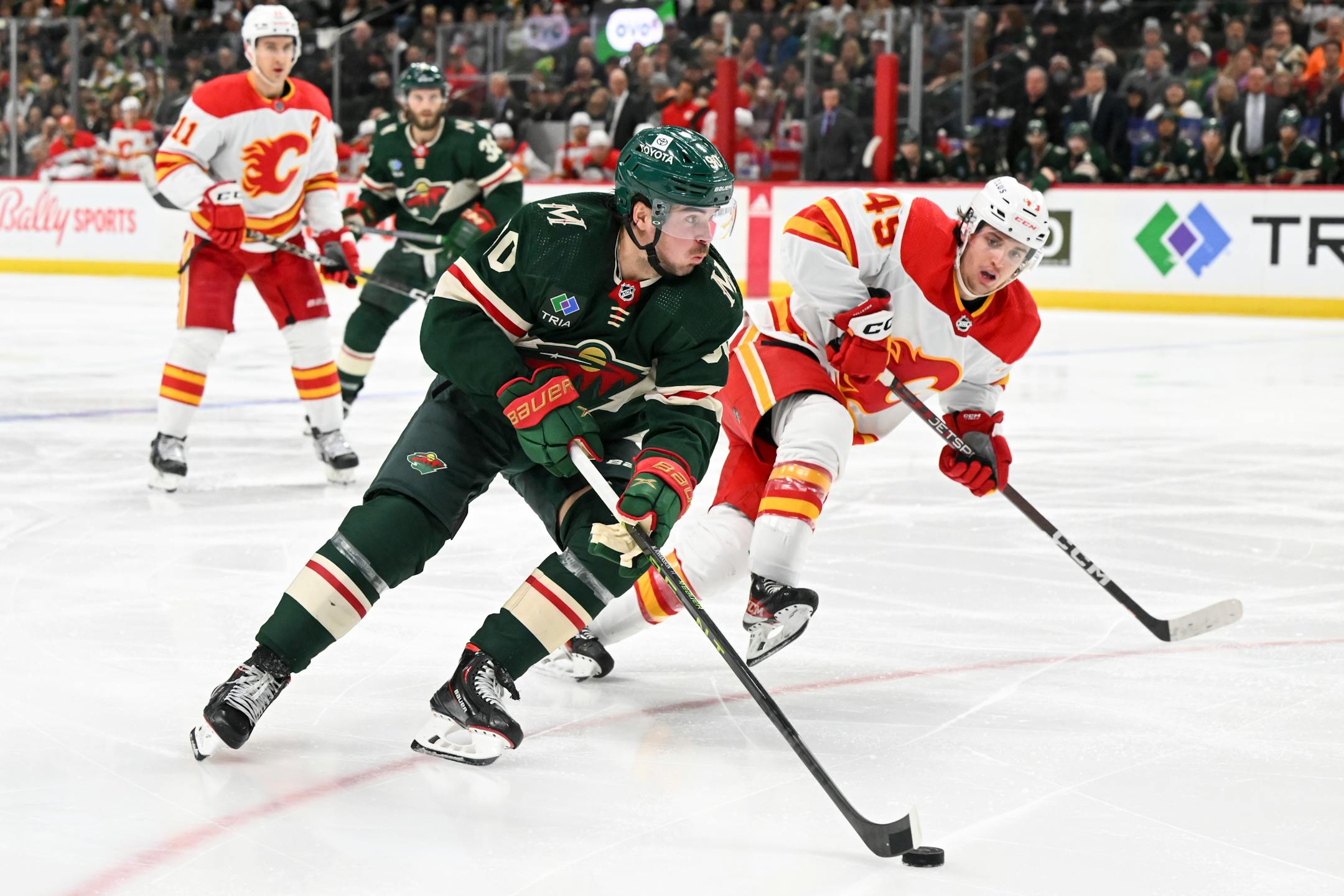 Minnesota Wild left wing Marcus Johansson (90) controls the puck against the Calgary Flames during the second period.