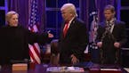 In a photo taken from video, Hillary Clinton, Donald Trump and Michael Flynn helped opened the latest episode of "Saturday Night Live."