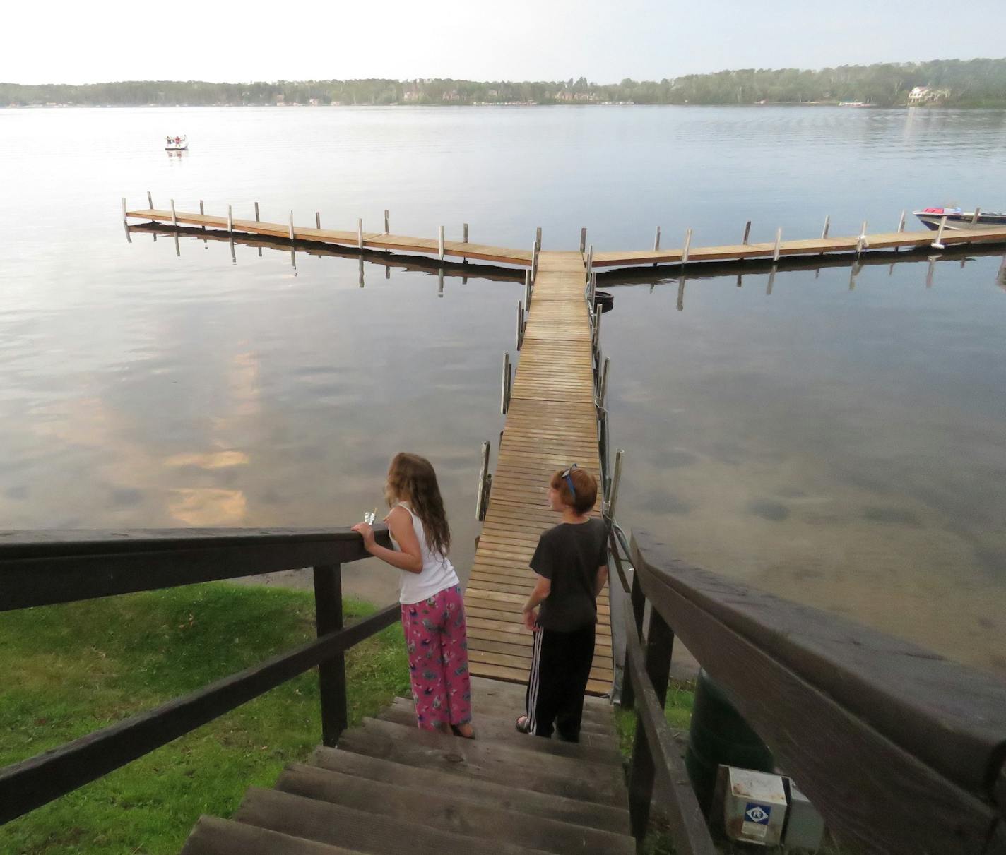 Children checked out the evening views of Gull Lake before heading to a campfire on the beach at Cragun&#x2019;s Resort.