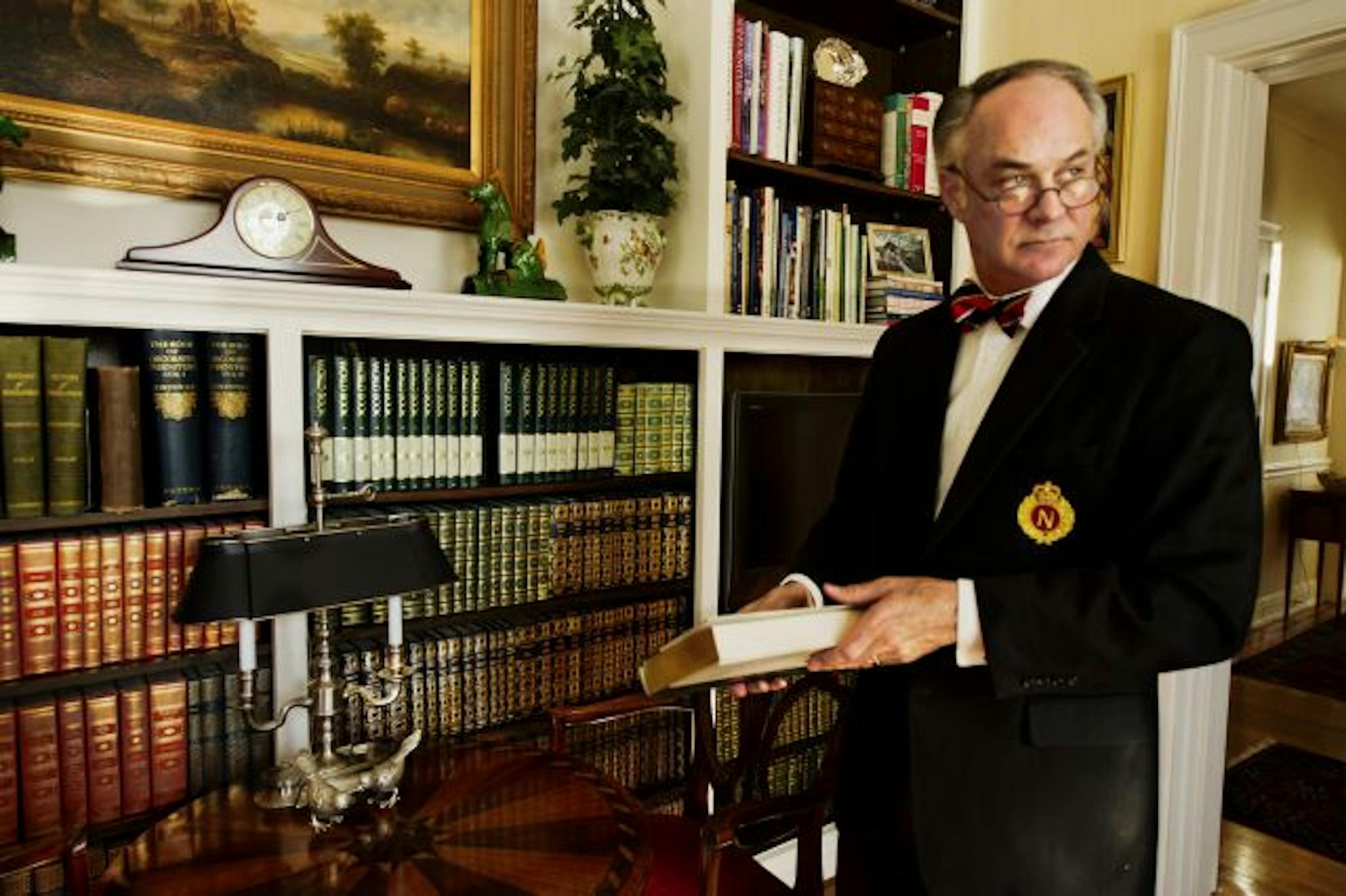 Jim Noble, an interior designer, loves the ambience that books add to a room, and expanded the shelves at his home library.