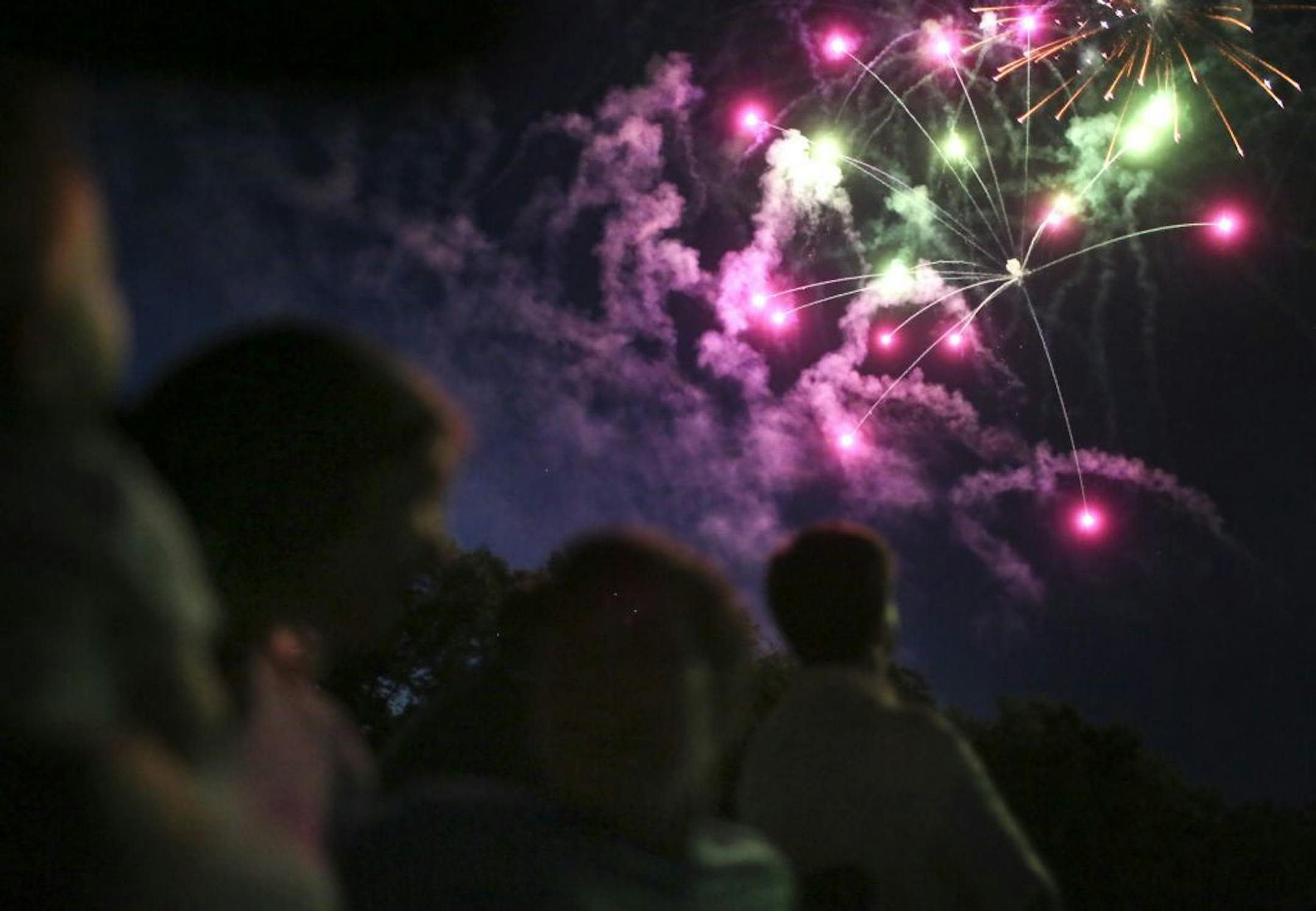 Amy Theis, 34, and her partner Nichol DePoint, 35, with their daughter Hattie, 1, at the Music in Plymouth celebration that culminated with a spectacular firework display Tuesday, July 2, 2013, in Plymouth, MN.