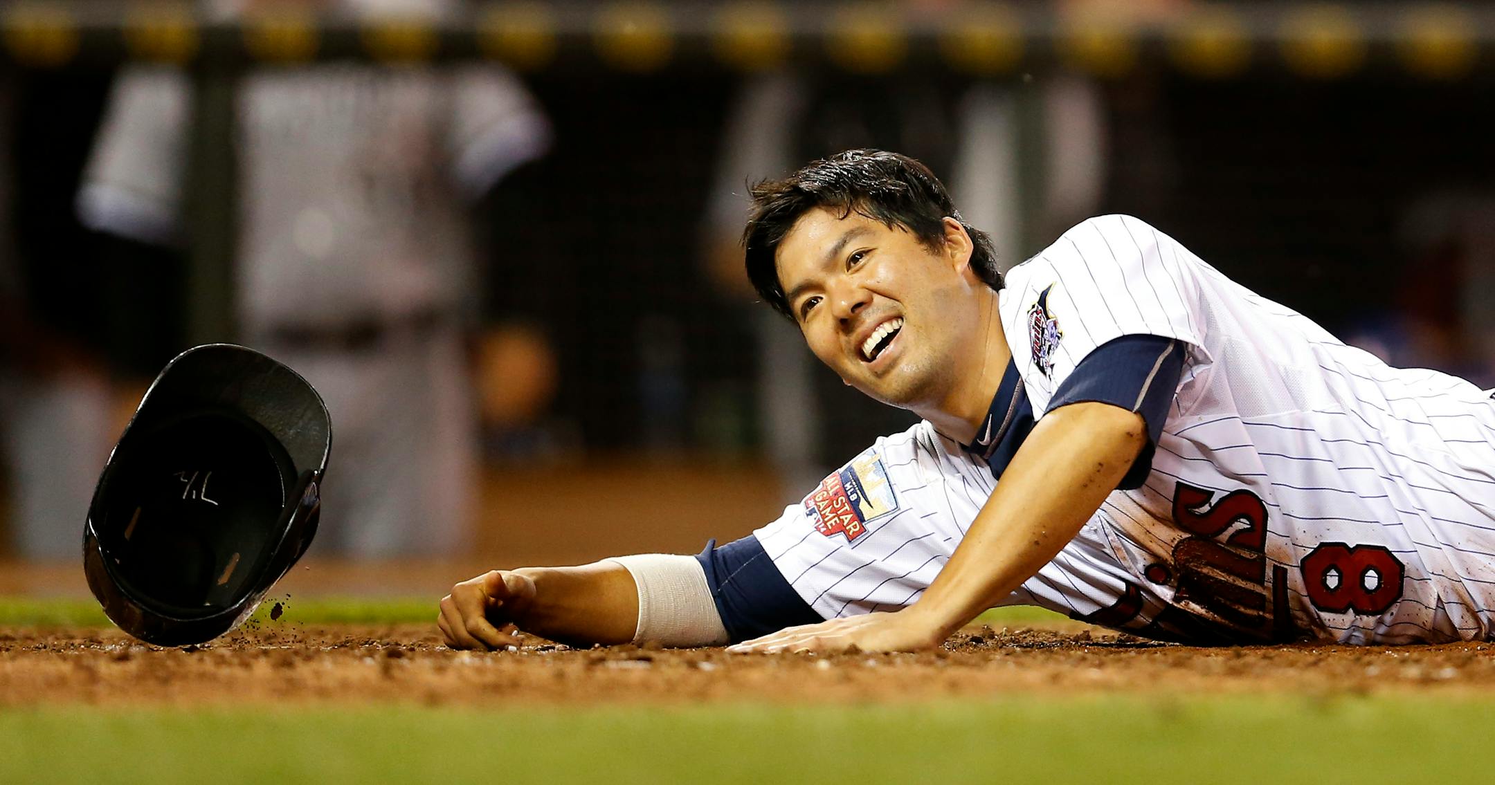 Kurt Suzuki (8) tossed his helmet at home plate