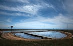 Oil-produced water sits in a polishing pond operated by the Cawelo Water District March 16, 2015 near Bakersfield, Calif. The canal moves oil produced