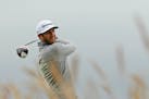 United States' Dustin Johnson drives the ball from the 15th tee during the first round of the British Open Golf Championship at the Old Course, St. An