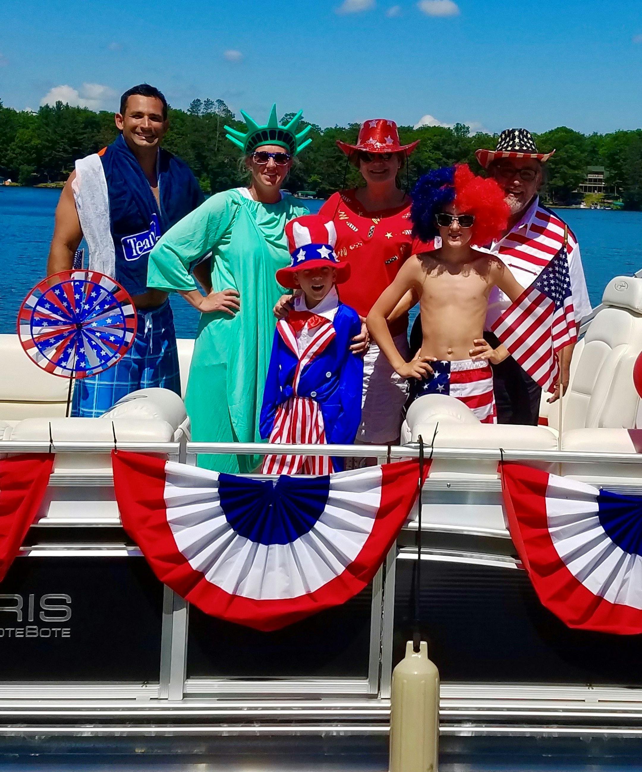 "Famous" Dave Anderson (far right) and his family dress up for the annual Fourth of July boat parade. Provided photo