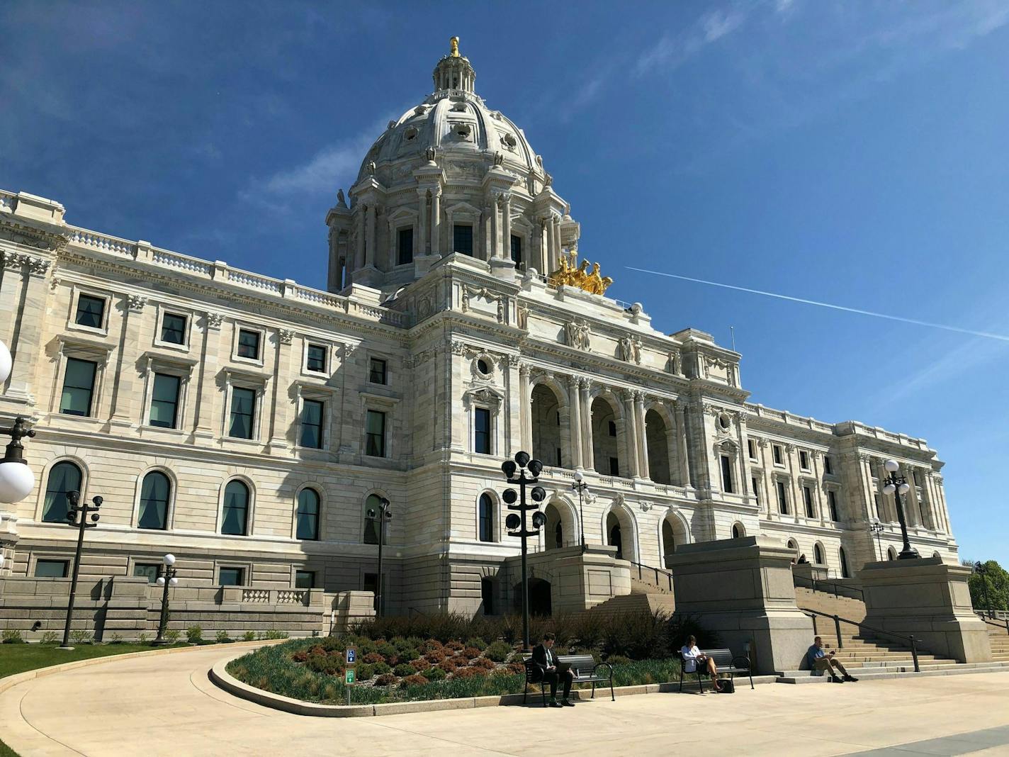 The sun shines on the Minnesota State Capitol in St. Paul, Wednesday, May 15, 2019, as Gov. Tim Walz and top legislative leaders continued their budget talks. Budget talks have resumed at the Minnesota Capitol, with Walz, House Democrats and Senate Republicans saying little publicly about their discussions. They're trying to complete a deal that would let the legislative session end as scheduled on Monday. The governor said Wednesday that the sides aren't saying much publicly because the talks a