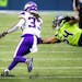 Vikings running back Dalvin Cook gets by Seahawks middle linebacker Bobby Wagner and Seahawks safety Ugo Amadi in the first half as the Seattle Seahaw