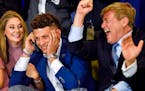 Randi Martin, Patrick Mahomes and Leigh Steinberg react while Mahomes is on a call with the Kansas City Chiefs during the 2017 NFL draft.