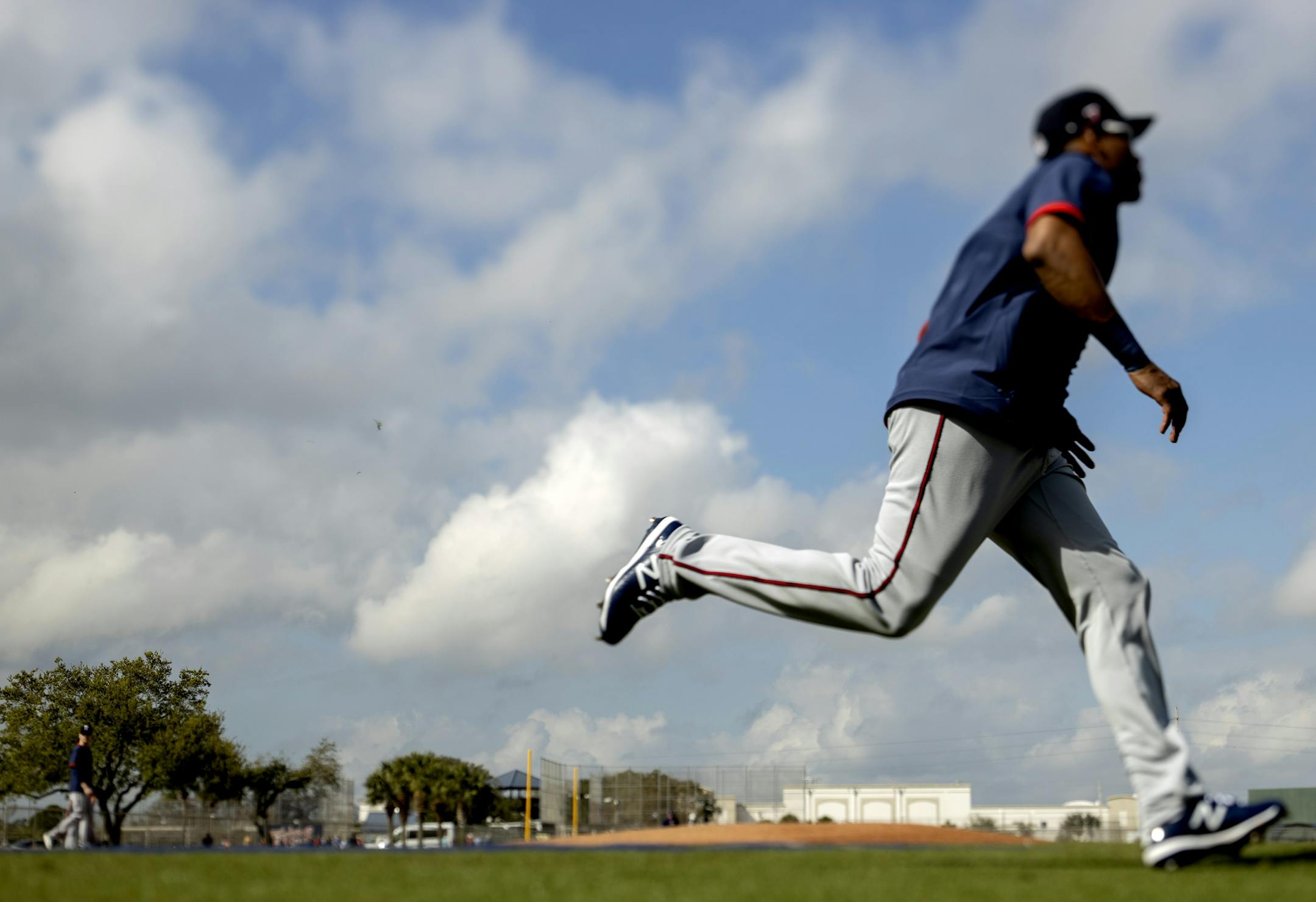 Minnesota Twins players ran the bases during the first day of practice for position players.