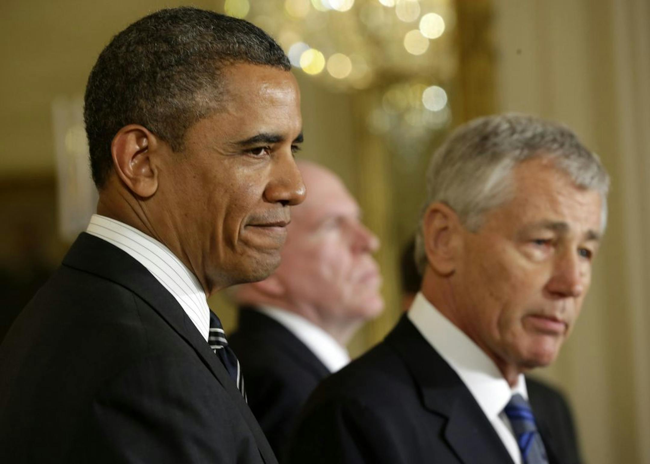 President Barack Obama listens in the East Room of the White House in Washington, Monday, Jan. 7, 2013, where he announced that he's nominating former Nebraska Sen. Chuck Hagel, right, as the new defense secretary.