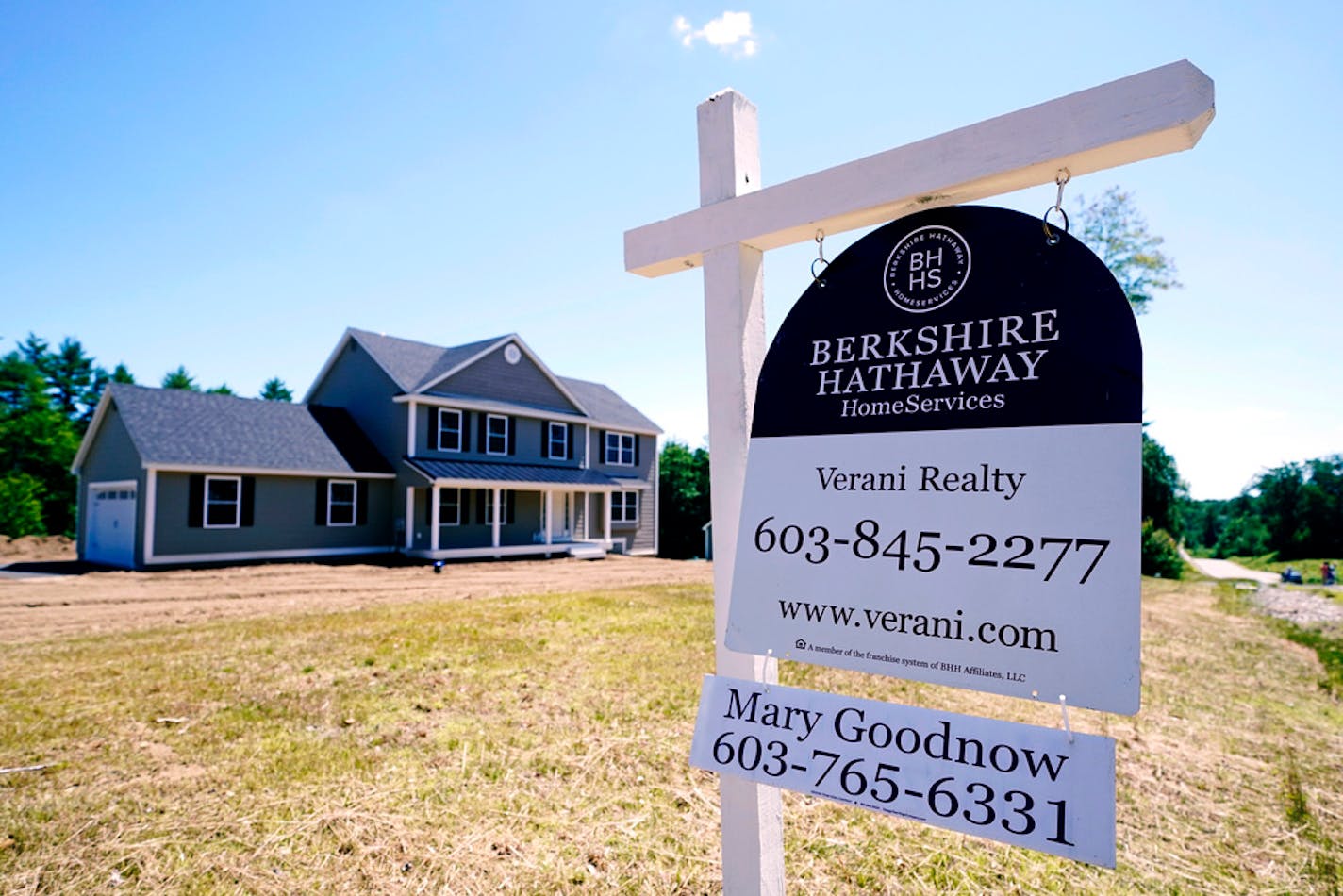 FILE - In this June 24, 2021 file photo, a real estate sign is posted in front of a newly constructed single family home in Auburn, N.H. U.S. home prices jumped by a record amount in June as homebuyers competed for a limited supply of available houses, the latest evidence that the housing market remains red-hot. (AP Photo/Charles Krupa, File)