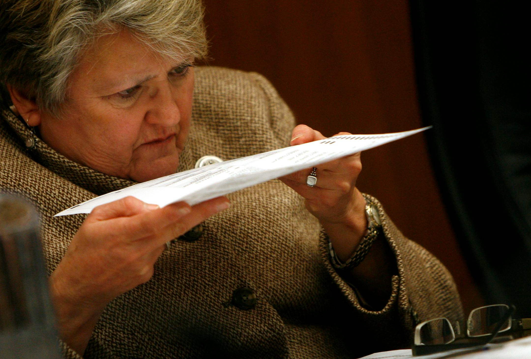 A challenged ballot is examined by Kathleen R. Gearin, Chief Judge, Second Judicial District as the State Canvassing Board met to resolve the disposition of the challenged ballots and to canvass the results of the recounts. The challenge was rejected and the vote went to Sen. Norm Coleman.