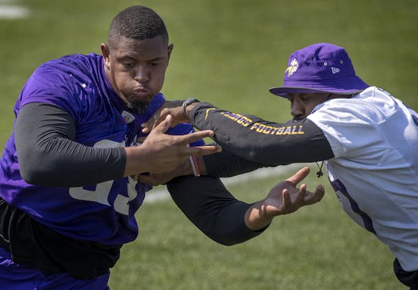 Minnesota Vikings offensive lineman Rashod Hill (69) blocked Everson Griffen (97) during the morning practice.