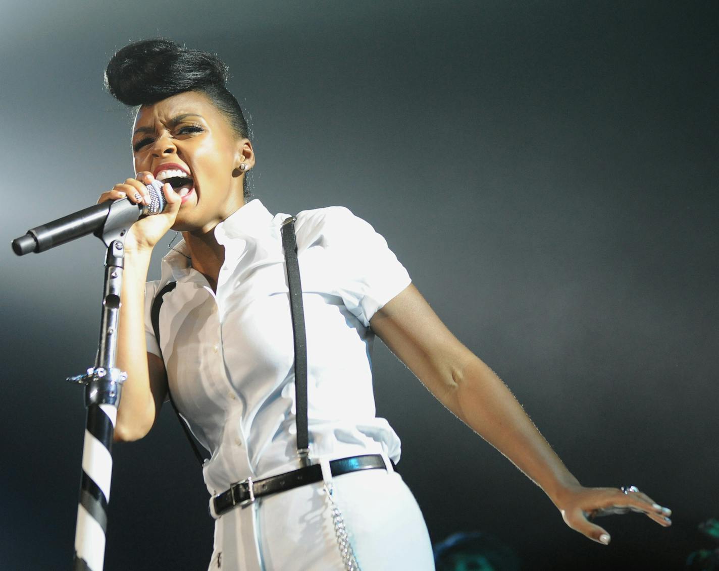 FILE - This July 7, 2013 file photo released by Essence shows Janelle Monae performing at the Essence Festival at the Superdome in New Orleans. Monae will sing at on Rebecca Minkoff&#x201a;&#xc4;&#xf4;s show at Lincoln Center, Friday, Sept. 6, during New York Fashion Week as part of &#x201a;&#xc4;&#xfa;American Express Unstaged,&#x201a;&#xc4;&#xf9; a program that pairs artists of different mediums and makes their collaborations available to the public through digital media, including a live stre