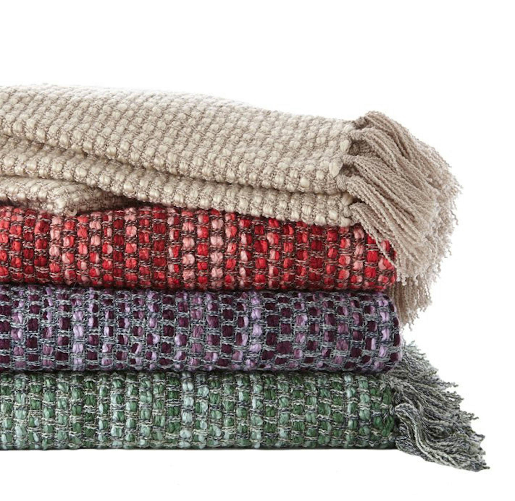 Martha Stewart Collection Harmony Throw ($60, www.macys.com). These soft blankets come in an array of colors, from deep red to heathered green. (Macy's/MCT) ORG XMIT: 1144949