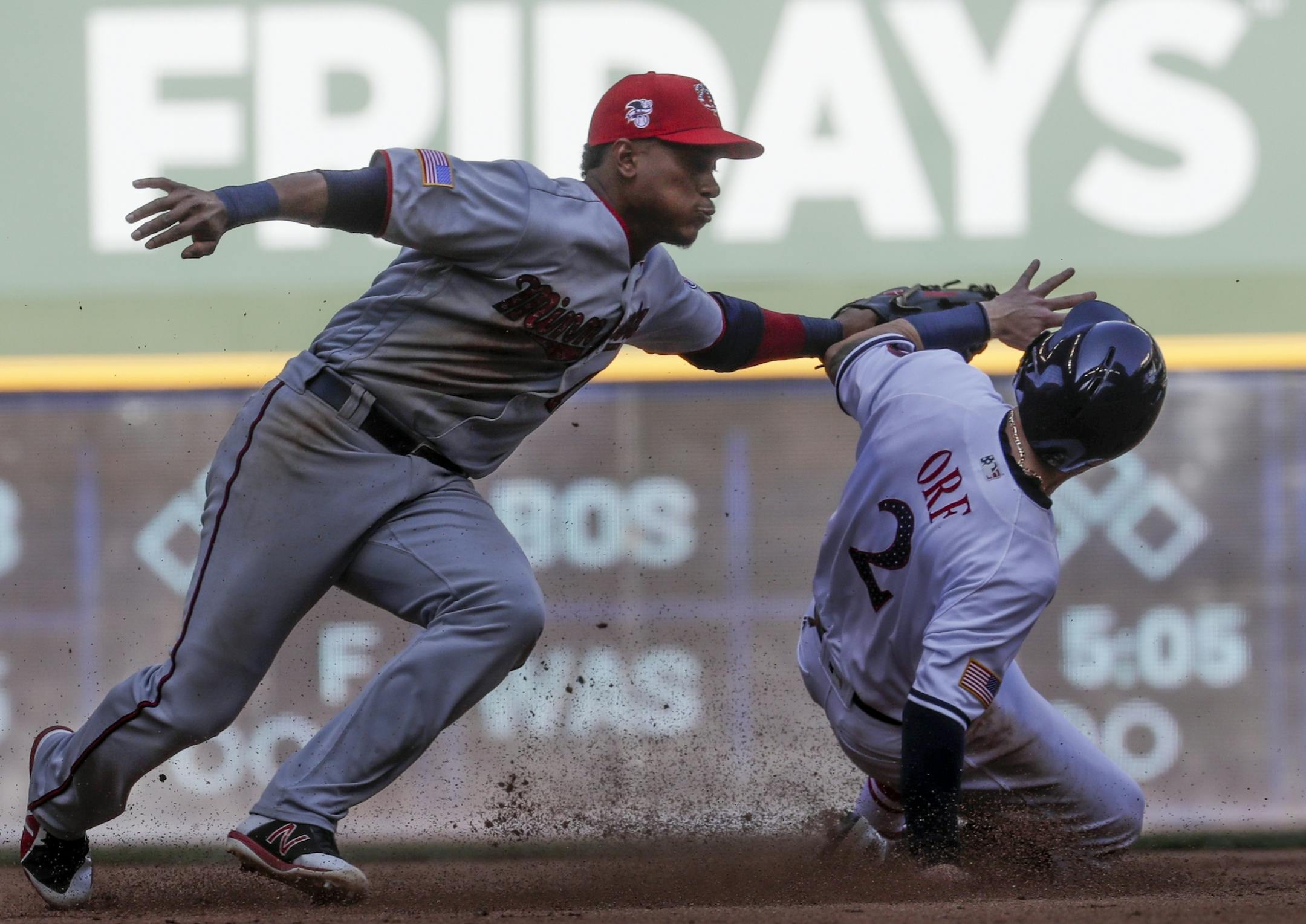 Milwaukee Brewers' Nate Orf steals second with Minnesota Twins' Jorge Polanco covering during the fifth inning of a baseball game Tuesday, July 3, 2018, in Milwaukee. (AP Photo/Morry Gash)