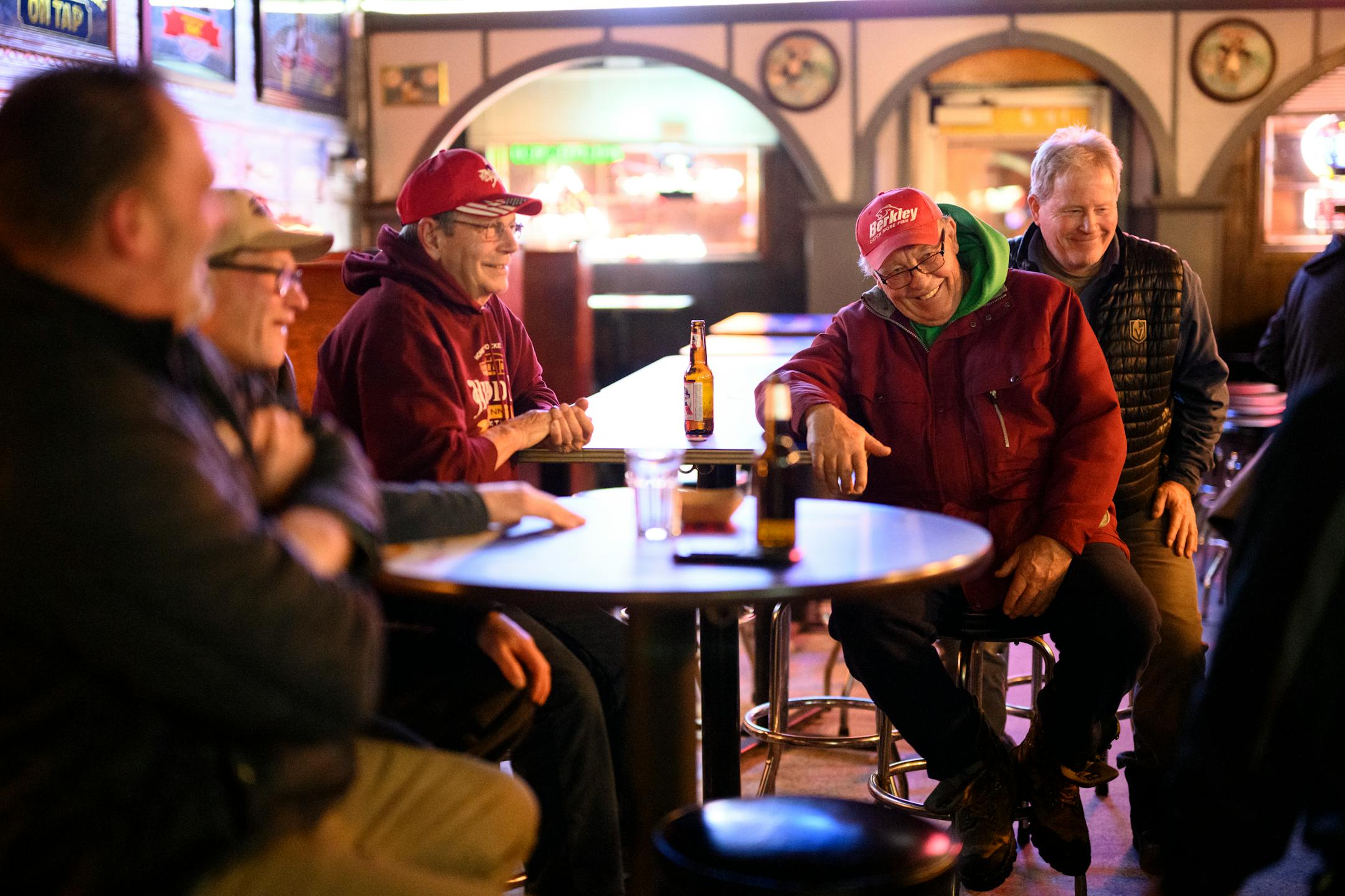 A group of former Virginia and Eveleth hockey players reminisce at Margie's Roosevelt Bar Monday, Feb. 21, 2022 in Eveleth, Minn. They include 65' Virginia graduate Mike Sertich, right of center, who was a longtime UMD hockey head coach. Left of center is Cal Cossalter, a1970 Eveleth graduate who went on to play for the Gophers under Herb Brooks and was part of the 1974 National Championship Team. At back right is Keith Hendrickson, a 1975 Virginia Grad who went on to play under Sertich at UMD and was a 25 year head coach for Virginia hockey.