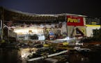 In this Tuesday, Sept. 10, 2019 photo, debris litters the ground at Advance Auto Parts following severe weather in Sioux Falls, S.D.