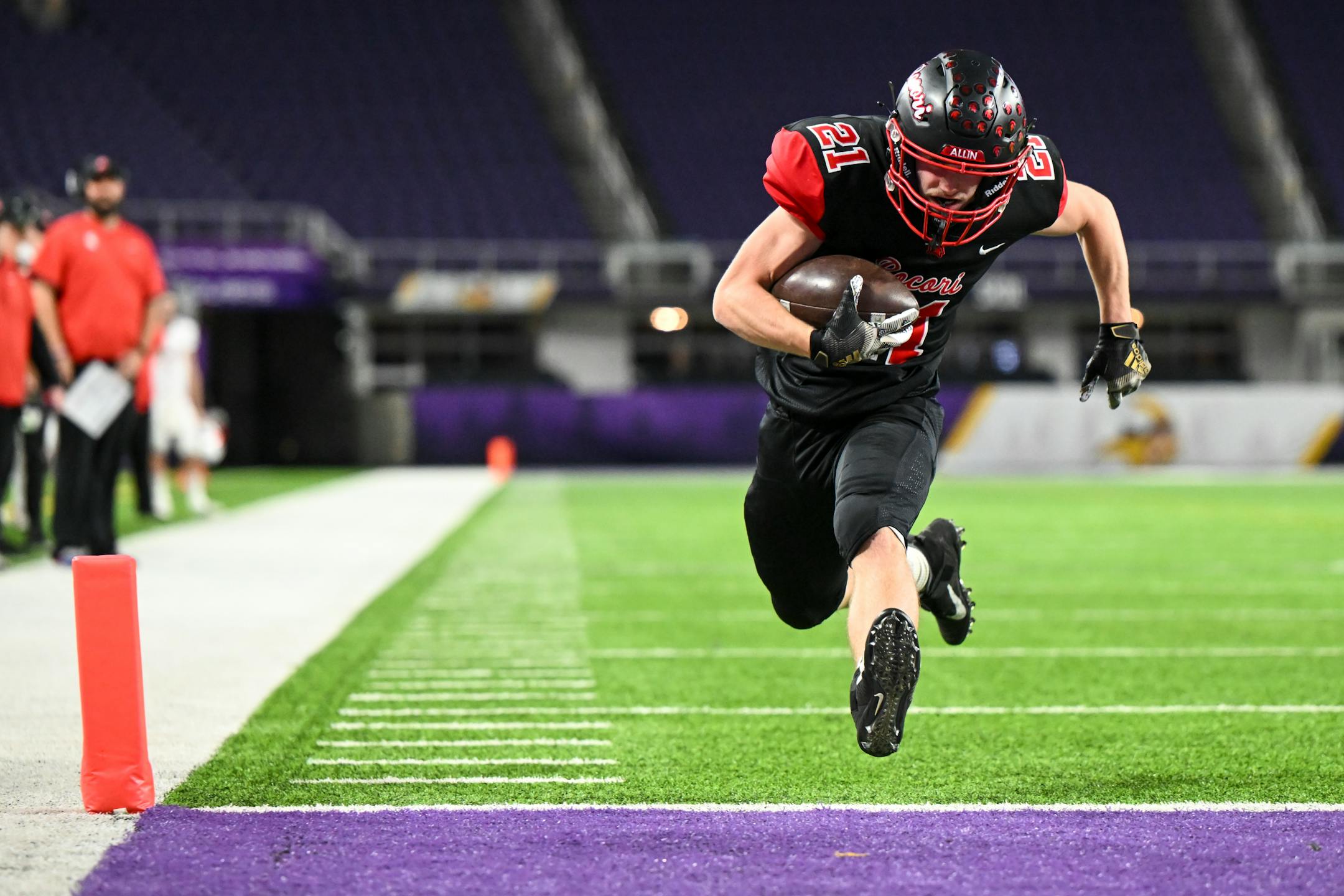 Rocori runningback Mason Dahl (21) scores a two point conversion on a run against Simley during the first half.