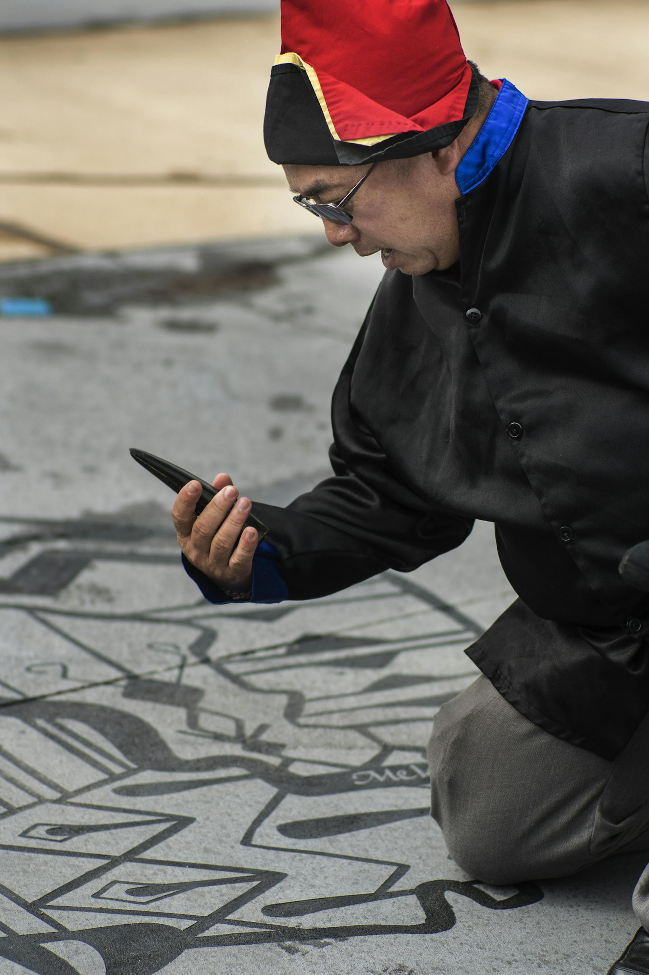 Hmong shaman Chad Lee blessed Little Mekong Plaza on a graphic part representing the Mekong River.] Little Mekong Plaza is dedicated on Wednesday, Sept. 28, as a community open space that will be central to the annual Little Mekong Night Market and the Hmong community in St. Paul. It's a small space, expected to have a big impact.Richard Tsong-Taatarii/rtsong-taatarii@startribune.com