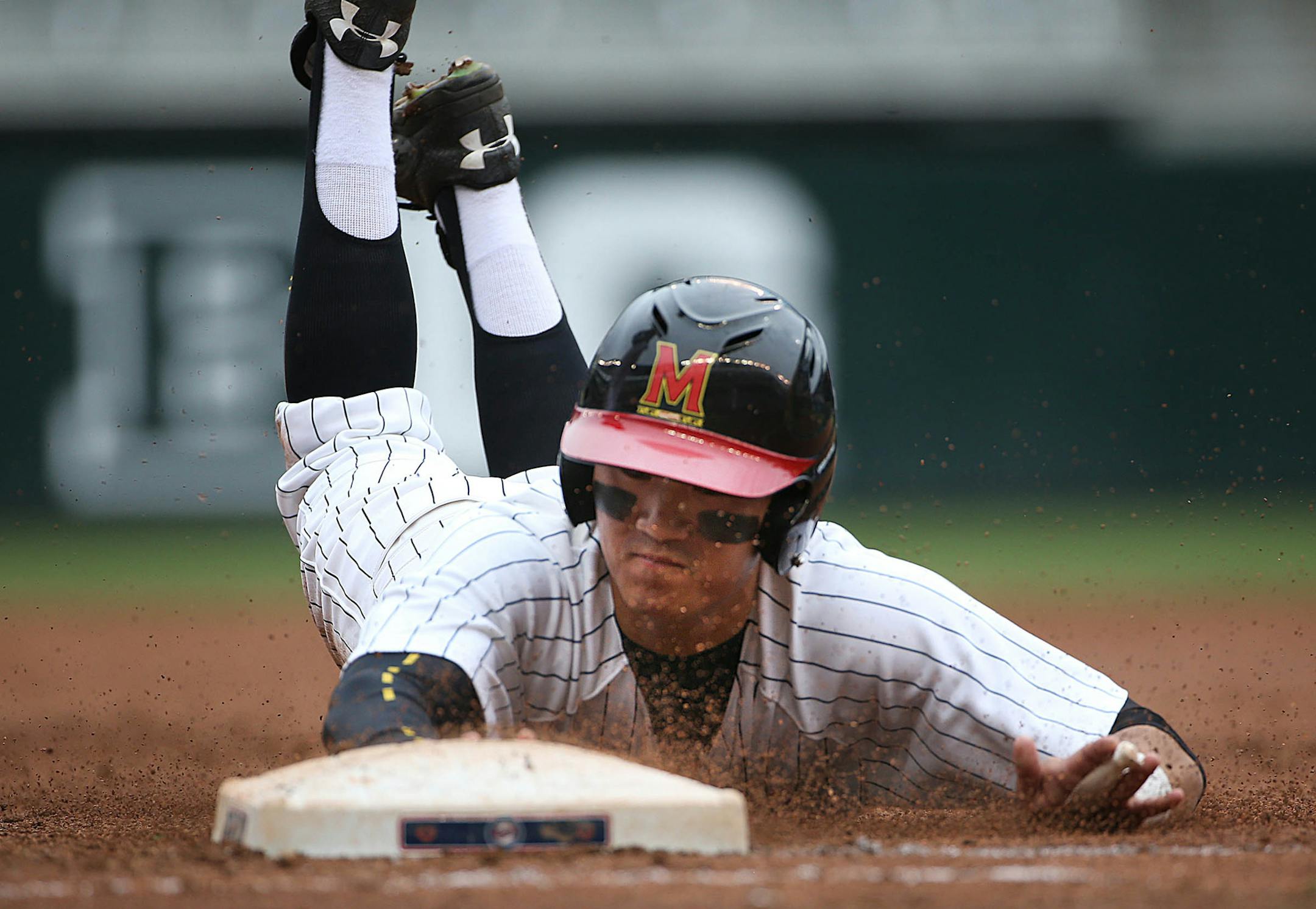Marylandís Kengo Kawahara dove back safely to first base in the third inning. ] JIM GEHRZ ï james.gehrz@startribune.com / Minneapolis, MN / May 23, 2015 / 9:00 AM ñ BACKGROUND INFORMATION: Maryland played Indiana on day four of the Big Ten baseball tournament at Target Field. Maryland won the game 4-2.