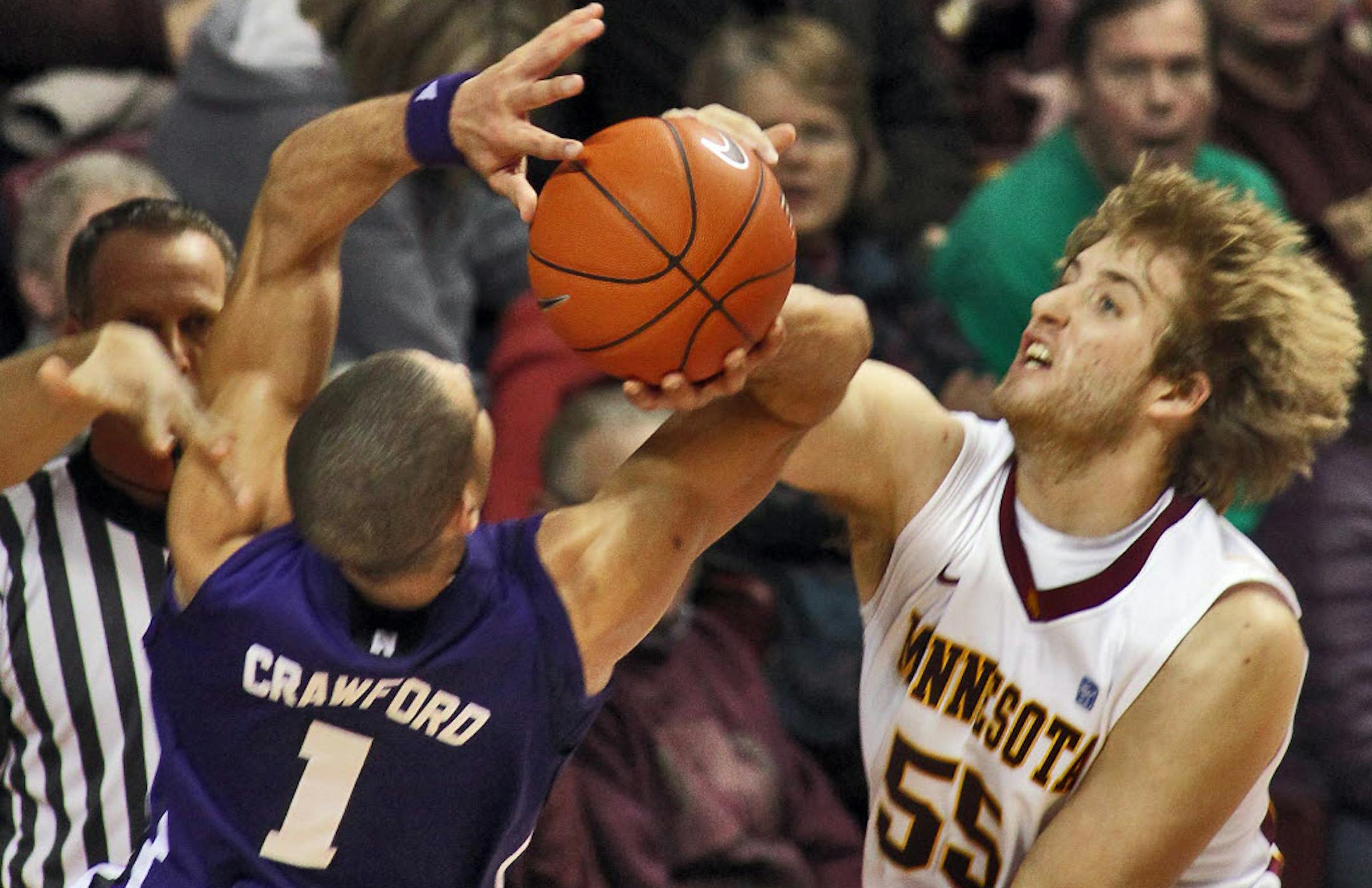 Gophers center Elliott Eliason (55) blocked the layup attempt of Northwestern's Drew Crawford during Minnesota's 75-52 victory Sunday.