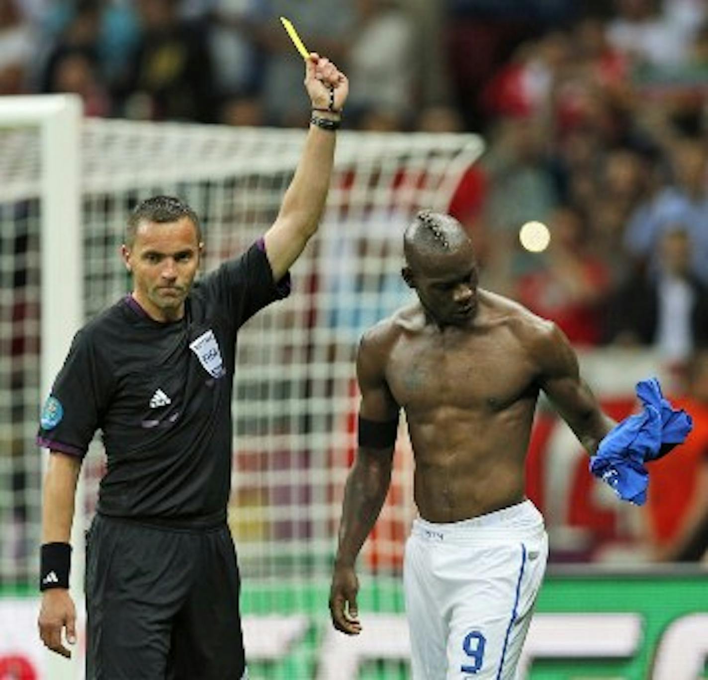 Mario Balotelli took his shirt off after his second goal and got a yellow card, but it was totally worth it. /AP Photo