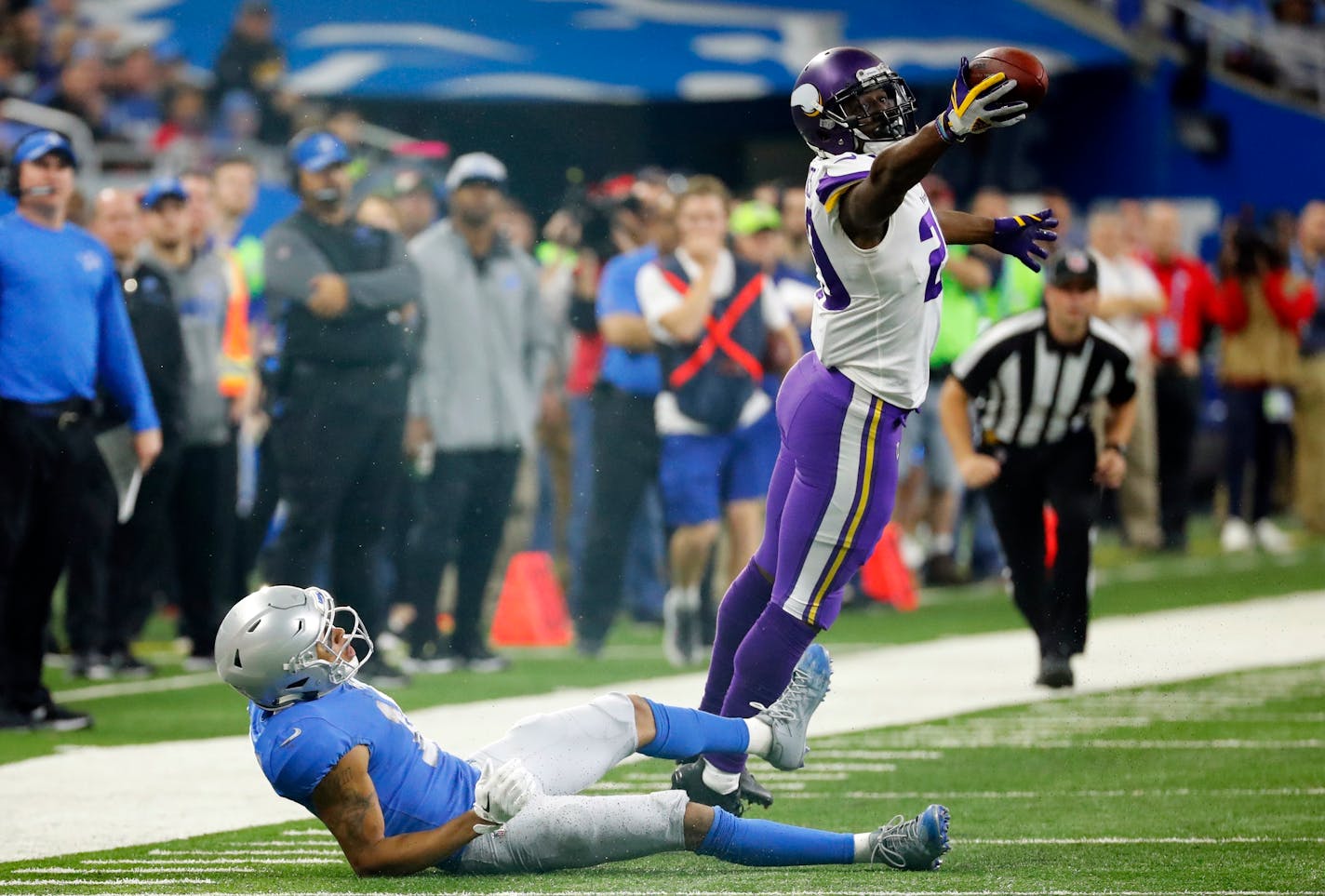 In this Thursday, Nov. 23, 2017, file photo, Vikings cornerback Xavier Rhodes intercepted a pass intended for Lions wide receiver Marvin Jones. The Vikings play host to the Lions at U.S. Bank Stadium on Sunday.