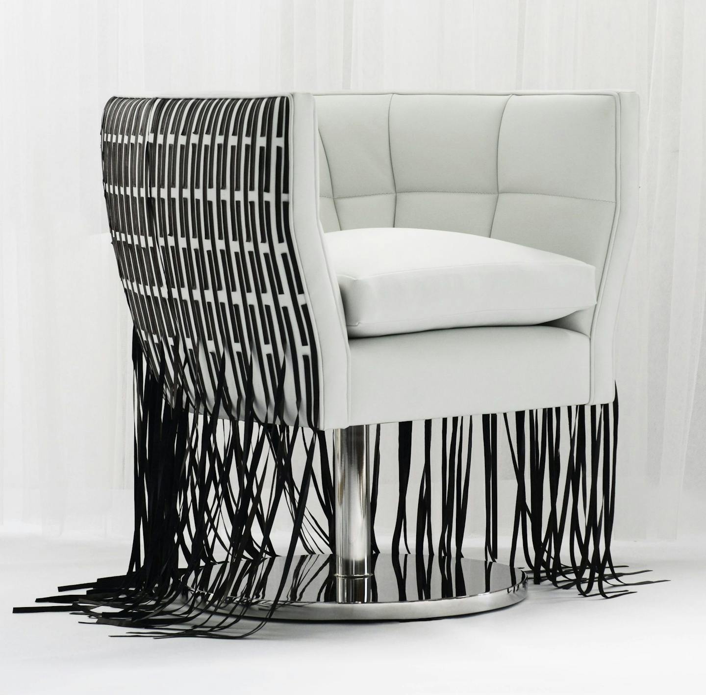 Leather fringe is finding its way to chairs and light fixtures.