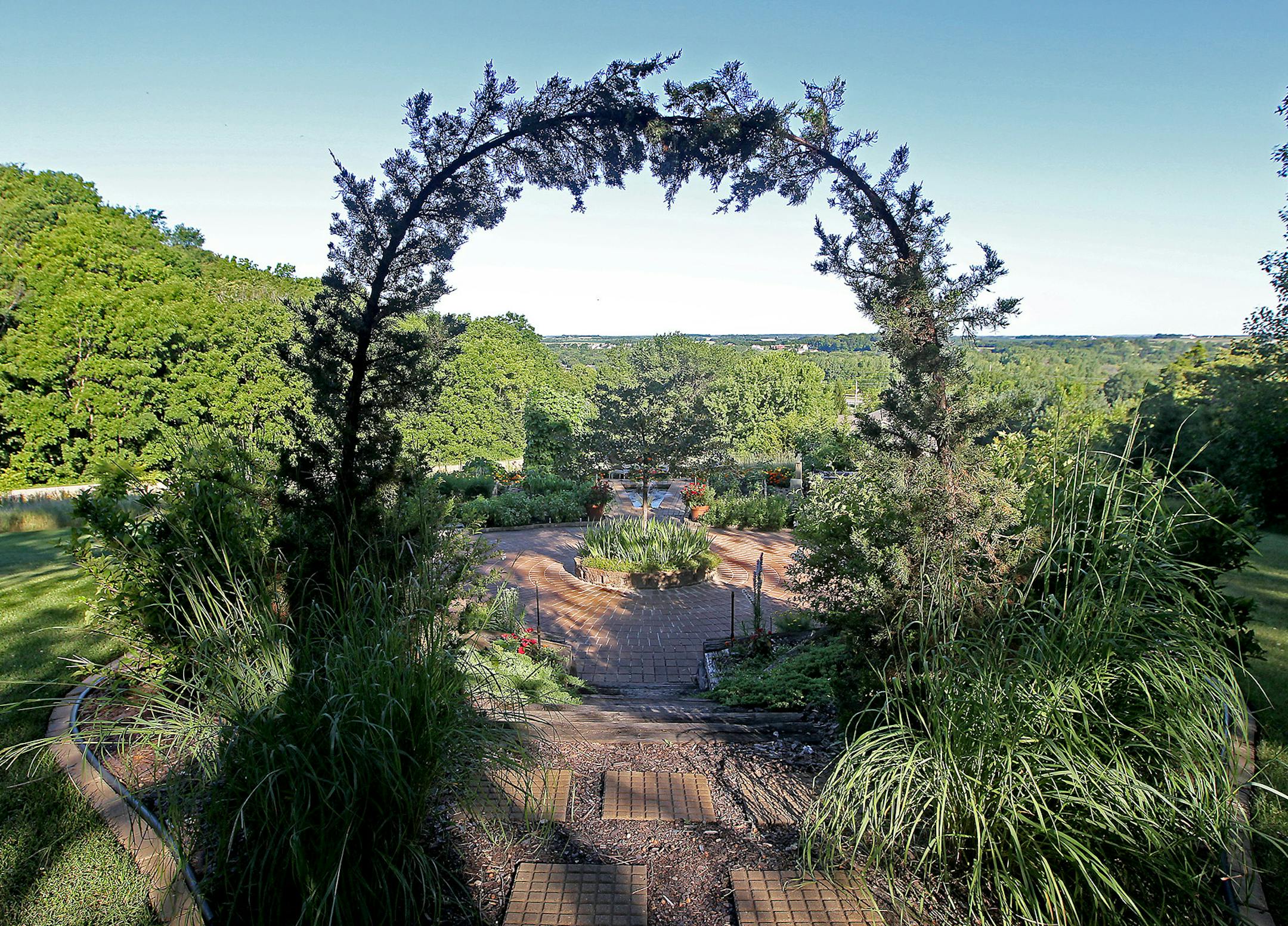 John and Carrie Duba's acreage on a hill overlooks the Cannon River Valley and includes a patio with pond and two-tiered vegetable garden.