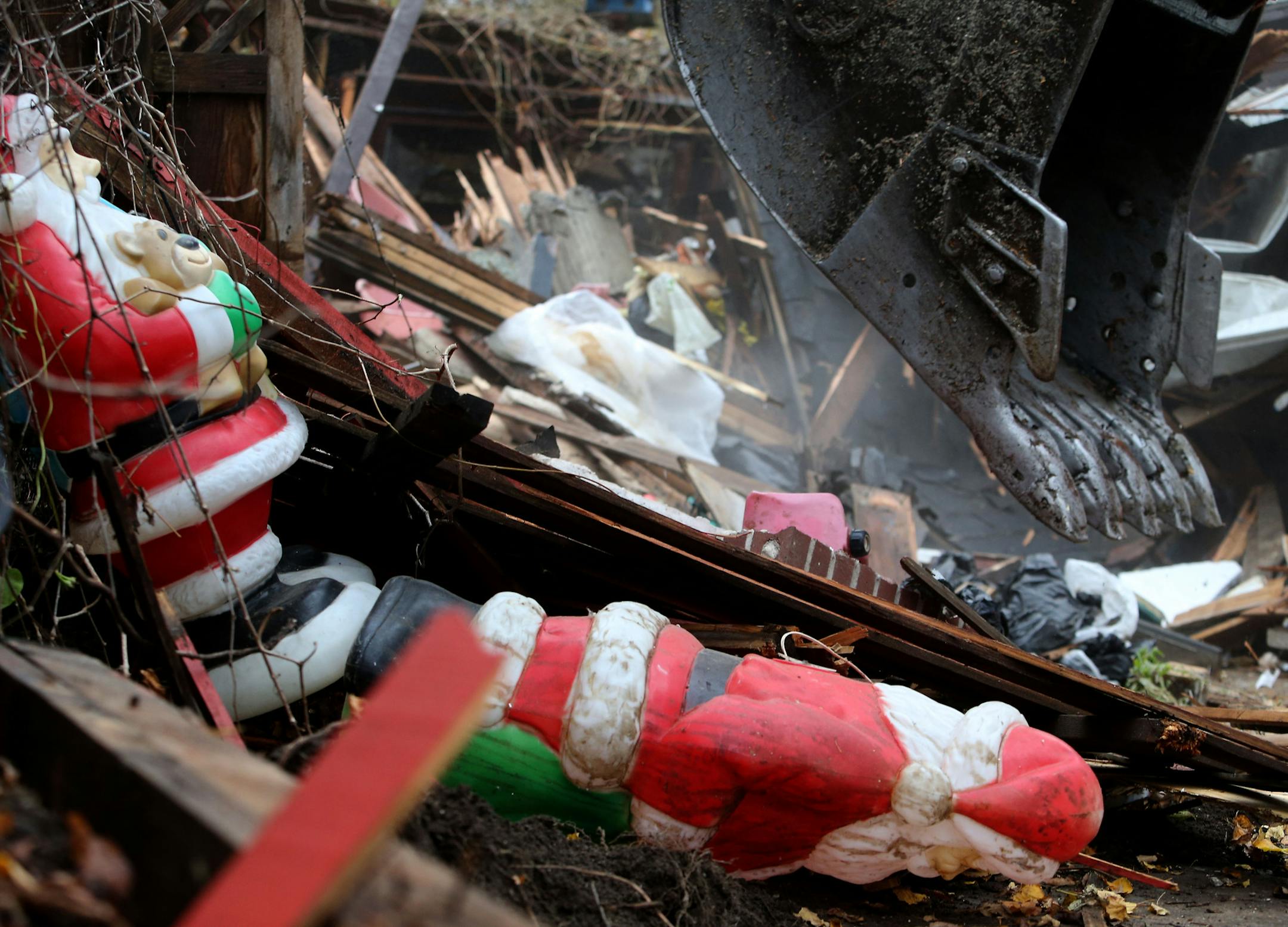 A demolition company took down a home damaged by fire in north Minneapolis in November. Homes in the area are being demolished, but not rebuilt.