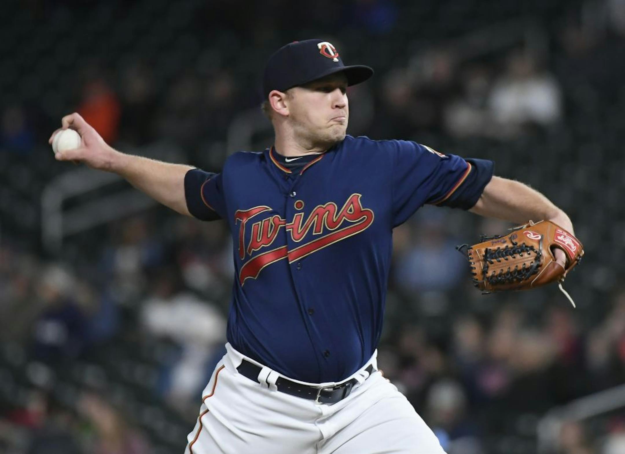 Minnesota Twins closing pitcher Tyler Duffey (21) threw three straight strikeouts to end the game in the top of the ninth inning.