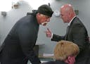 Hulk Hogan, left, whose real name is Terry Bollea, talks with attorney Shane Vogt as he appears in court Wednesday, May 25, 2016, in St. Petersburg, F