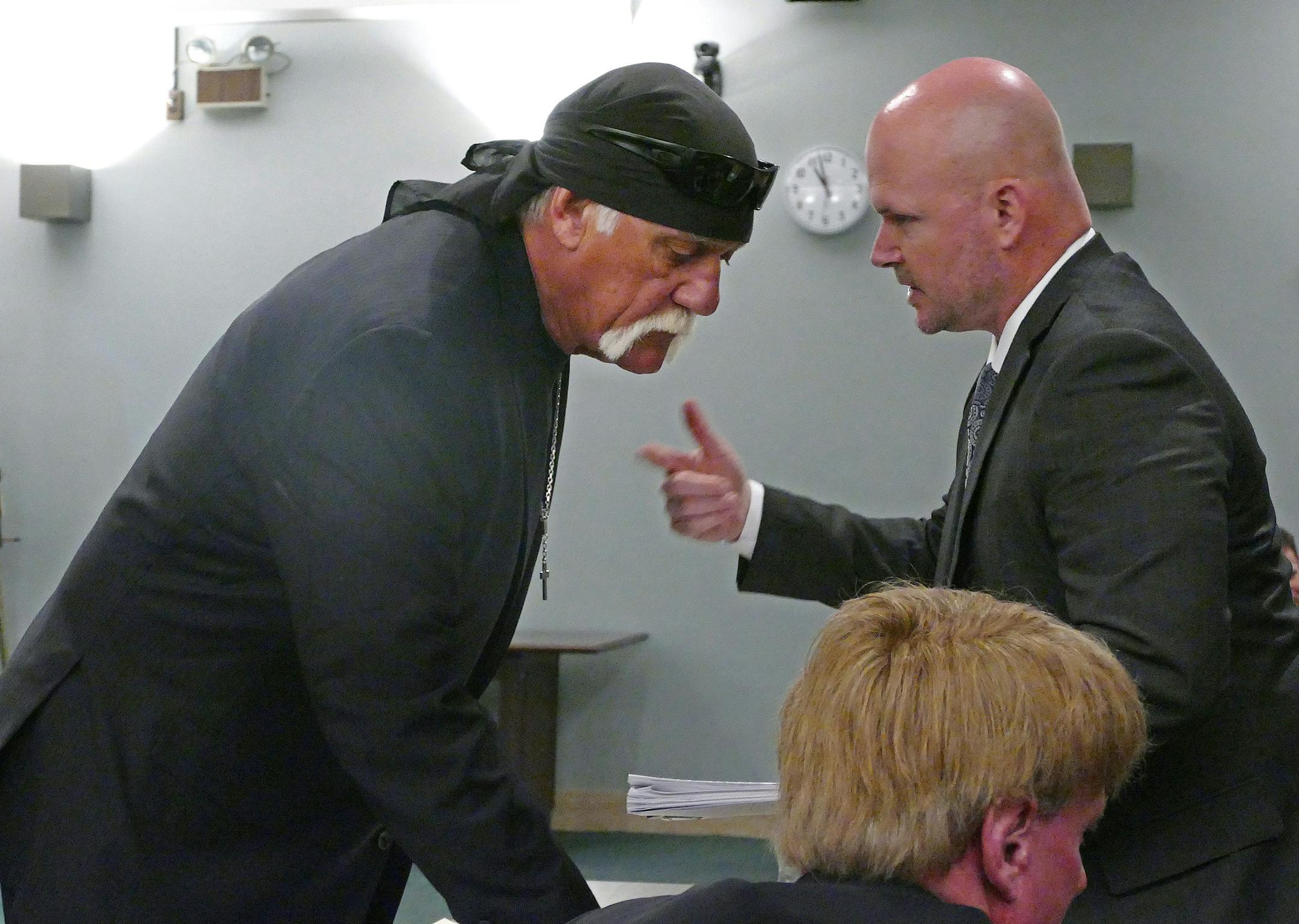 Hulk Hogan, left, whose real name is Terry Bollea, talks with attorney Shane Vogt as he appears in court Wednesday, May 25, 2016, in St. Petersburg, Fla. A Florida judge on Wednesday denied Gawker's motion for a new trial in Hogan's sex-video case and won't reduce a $140 million jury verdict. (Scott Keeler/The Tampa Bay Times via AP, Pool)