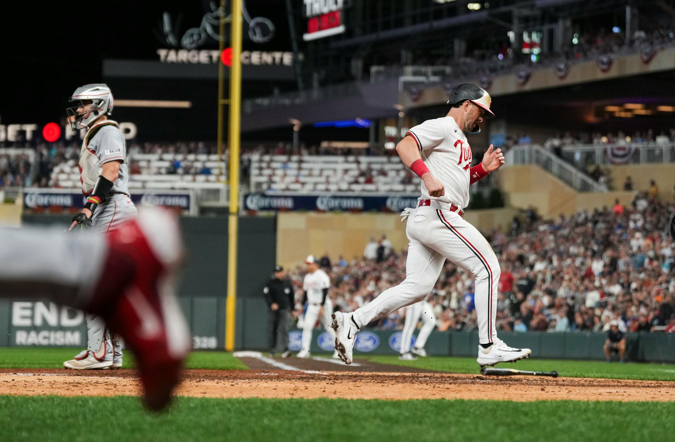 Minnesota Twins short stop Kyle Farmer (12) runs home on a sacrifice fly by Minnesota Twins Alex Kirilloff (19) in the fourth inning. The Minnesota Twins hosted the Los Angeles Angels at Target Field on Friday, Sept. 22, 2023 in Minneapolis, Minn. ] RENEE JONES SCHNEIDER • renee.jones@startribune.com