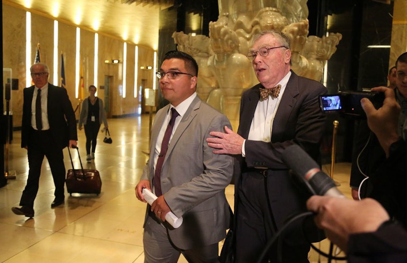 Jury selection began today for the first day of trial of officer Jeronimo Yanez in the fatal shooting of Philando Castile. Here, in a seeming change of legal strategy, officer Jeronimo Yanez, middle, appeared in public briefly with his attorney Tom Kelly, right, and other legal team members while leaving the Ramsey County Courthouse Tuesday, May 30, 2017, in St. Paul, MN.