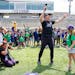 Minnesota Vikings head coach Kevin O'Connell concludes a volunteer community event with chant Thursday, June 1, 2023, at TCO Performance Center in Eag