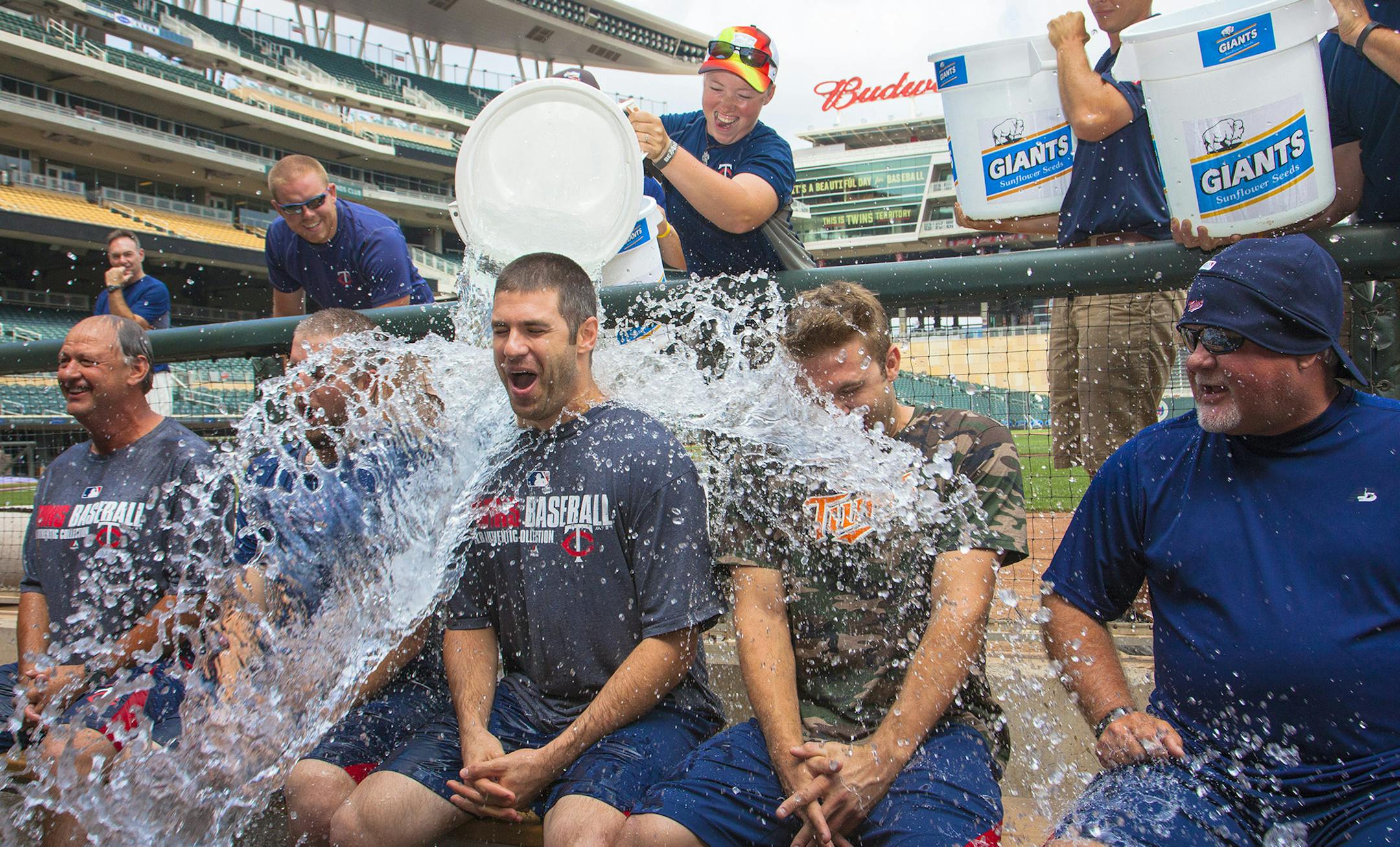MINNEAPOLIS, MN- Members of the Minnesota Twins, including Joe Mauer, center, and manager Ron Gardenhire, right, took part in the Ice Bucket Challenge. ] PHOTO BY BRACE HEMMELGARN/MINNESOTA TWINS ORG XMIT: 493623965 ORG XMIT: MIN1408191746327627