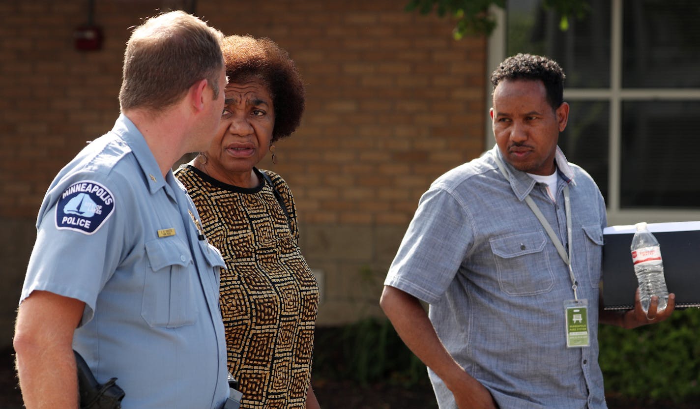 Park Police Chief Jason Ohotto, Park interim-Superintendent Mary Merrill, and Abdirahman Mukhtar the Parks' community outreach and access coordinator talked as they walked from a meeting with the family of the four Somali-American teens who were detained by park police Tuesday during a private meeting Friday at the Brian Coyle Community Center in Minneapolis. ] ANTHONY SOUFFLE &#xef; anthony.souffle@startribune.com Park Police Chief Jason Ohotto, Park interim-Superintendent Mary Merrill and Park