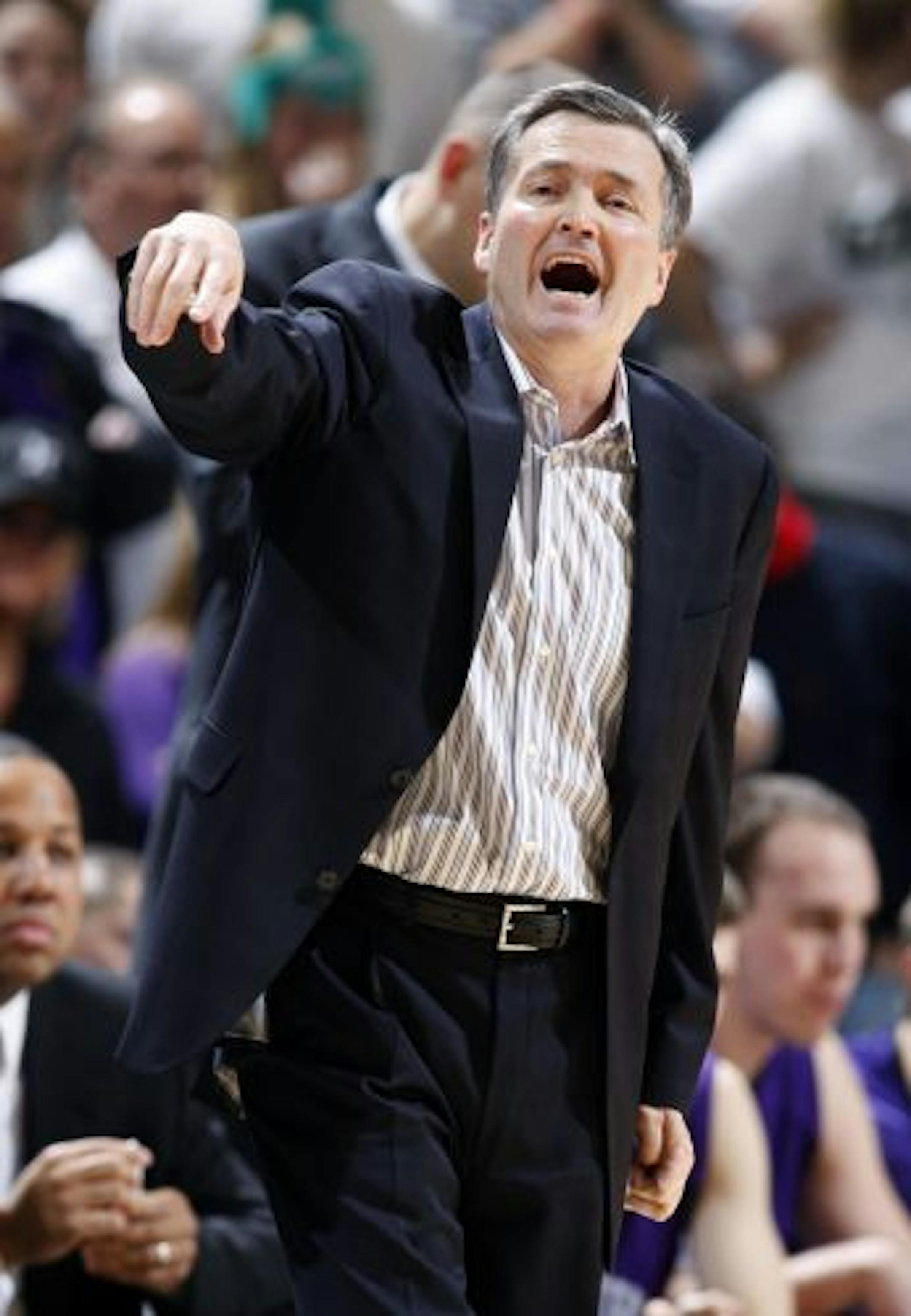 Northwestern coach Bill Carmody directs his team during the second half of an NCAA college basketball game against Michigan State, Saturday, Jan. 15, 2011, in East Lansing, Mich. Michigan State won 71-67 in overtime.