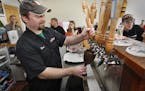 Co-owner Brad Glynn pulls a brew in the tap room of Lift Bridge Brewery in Stillwater in this file photo from April 14, 2011.