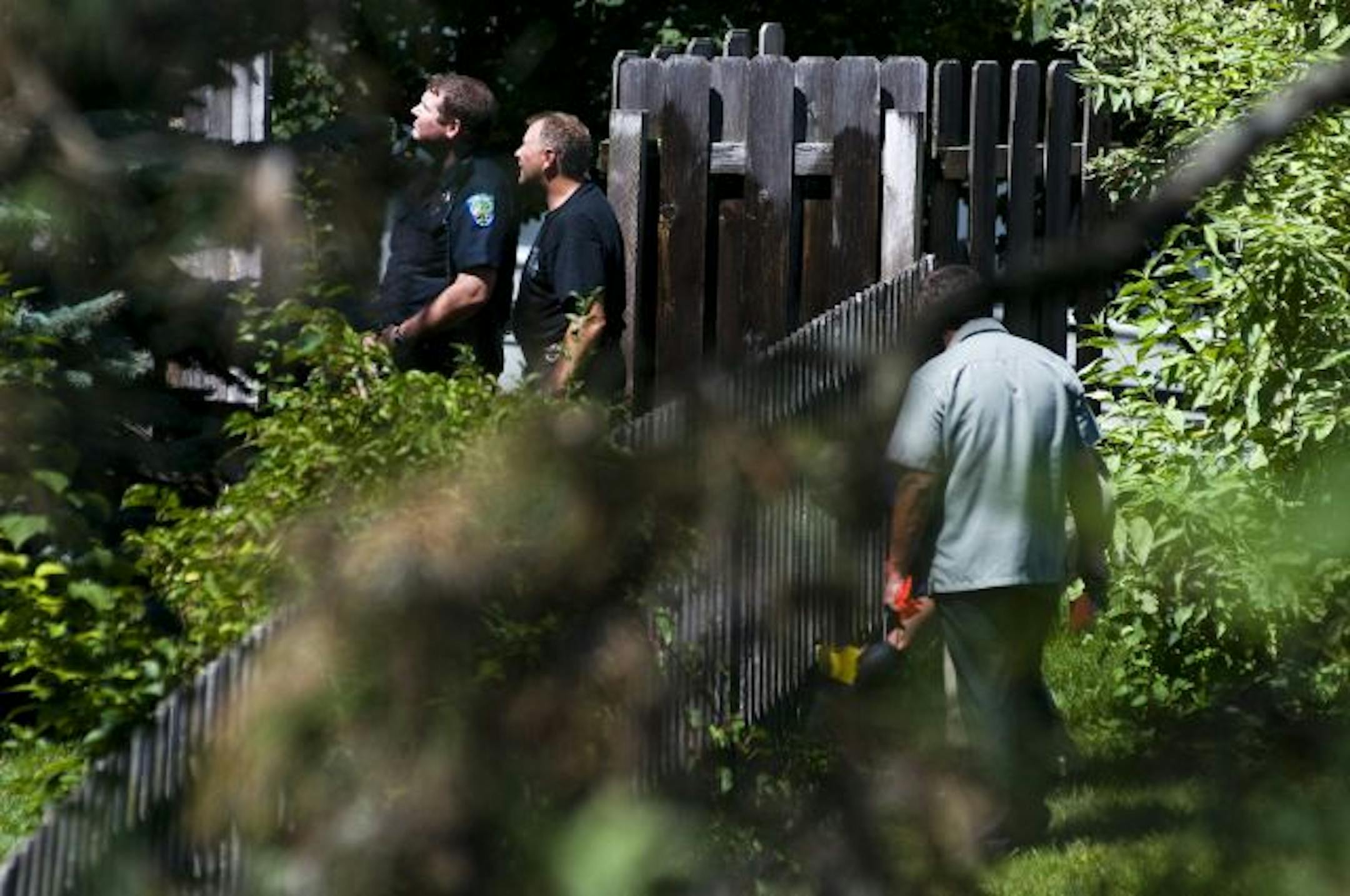 Eagan police on Wednesday checked out the side of the house where a double murder-suicide took place Tuesday night. Police on Thursday identified the gunman as Robin C. Bhattacharyya of Minneapolis, the ex-husband of Svetlana Hanson. His car was found nearby.